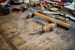 Leather crafting tools on working desk
