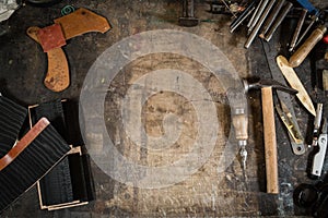 Leather crafting tools on working desk