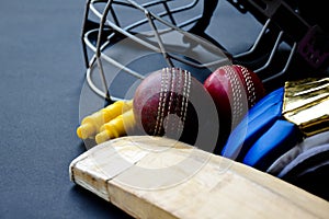 Leather cricket ball, wickets, helmet, gloves and wooden bat