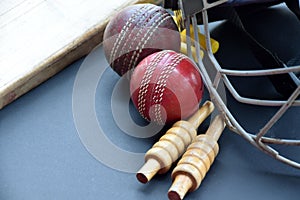 Leather cricket ball, wickets, helmet and wooden bat