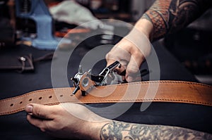 Leather cutter keen on one& x27;s business in the studio