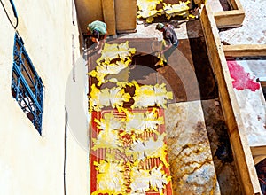 Leather dries in the sun after painting, tannery in the ancient Medina of Fes, Morocco. Top view