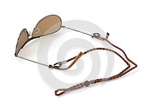 Leather eyeglass cord attached to sunglasses photo