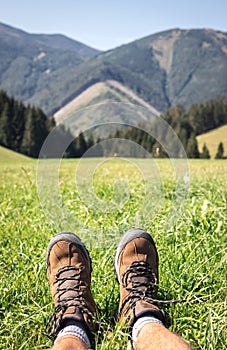 Leather hiking boots in mountains