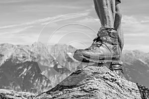 Leather hiking shoe of a man stepping on a small rock in the Ziller Valley, Austria