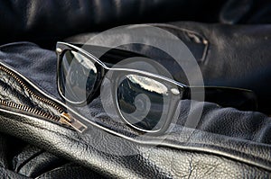 Leather jacket detail with sunglasses