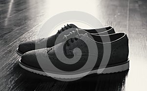 Leather Men`s Brogue Shoes on The Floor in Black & White