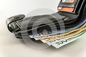 Leather men`s open wallet with euro banknotes bills, coins and c