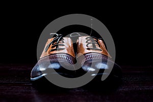 Leather men's shoes on black background