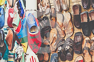 Leather moroccan slippers in traditional market in medina of Mar