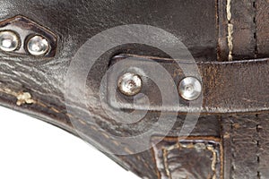 Leather product with rivets and seam
