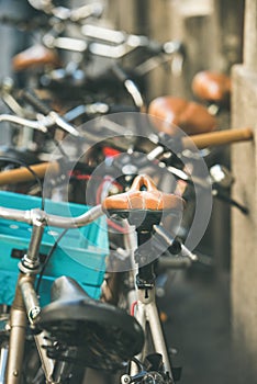 Leather saddle of bicycle parked in the street of Budapest