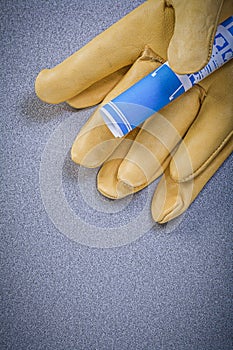 Leather safety gloves blue blueprint on grey background construc