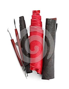 Leather samples and craftsman tools isolated on white