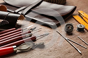 Leather samples and tools on brown table