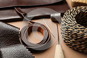 Leather samples and tools on table