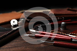 Leather samples and tools on wooden table