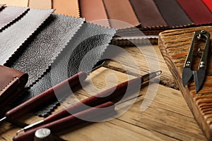 Leather samples and tools on wooden table