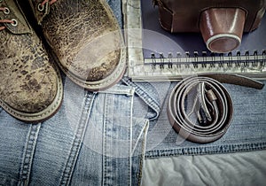 Leather shoe, equipment on jeans background.
