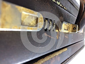 Leather Suitcase with combination lock Closeup on white background