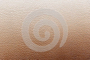 The leather texture background in the light brown tone