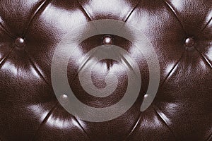 Leather upholstery texture of sofa. brown couch close up background