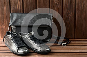 Leather upper metallic womens shoes and black leather bag on bro