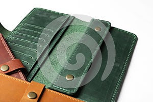 Leather wallets on white background. Stylish accessories