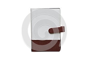 Leather white and brown notebook which has magnetic lock on white background with clipping path