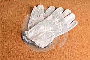 Leather work gloves on background