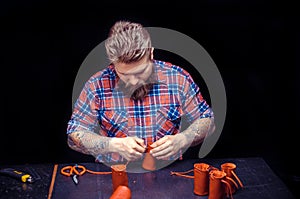 Leather Worker processes a workpiece from leather