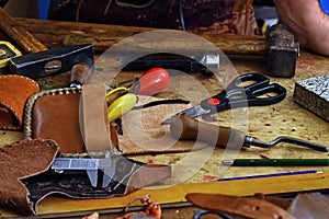 Leathercraft working tools on workshop desk