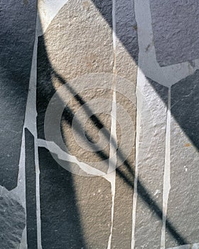 Leathered soapstone tile with irregular white inlay lines and soft matte texture photo