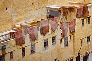 The leathers are dried on the roofs of the old tannery buildings in Fez. Morocco. The tanning industry in the city is considered