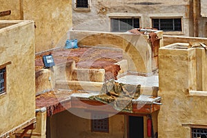 The leathers are dried on the roofs of the old tannery buildings in Fez. Morocco. The tanning industry in the city is considered