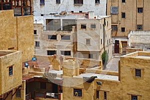 The leathers are dried on the roofs of the old tannery buildings in Fez. Morocco. The tanning industry in the city is considered photo