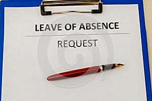 Leave of absence request on the tablet at the table. photo