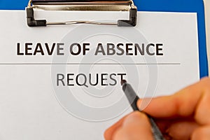 Leave of absence request on the tablet at the table. photo