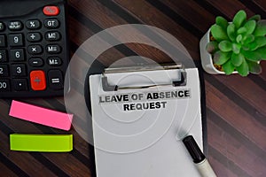 Leave of Absence Request write on a paperwork isolated on Wooden Table