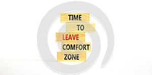 Leave comfort zone symbol. Concept words Time to leave comfort zone on wooden blocks. Beautiful white table white background. photo