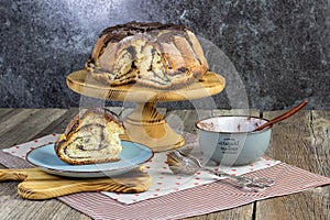 Leavened cocoa cake with chocolate set on old wood table