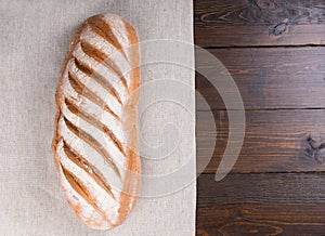 Leavened durum flour bread loaf on table photo