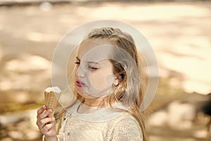 It leaves a bad taste in the mouth. Cute little girl dislike taste of ice cream. Small child licking ice cream with