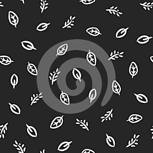 Leaves and branches drawn by hand with rough brush. Organic seamless pattern.