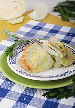 Leaves of cabbage fried in batter