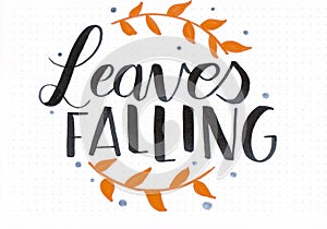 `Leaves Falling` hand lettering phrase with writing and orange leaves