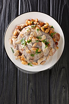 Lebanese Chicken and Rice Riz bi-Djaj closeup in the plate. vertical top view