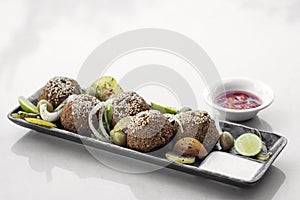 Lebanese falafel plate with pickles salad and sauces