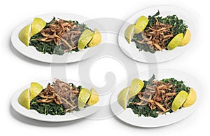 Lebanese food of Cooked hindbeh with fried onion and lemon isolated on white, Clipping Path Included