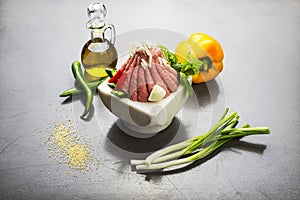 Lebanese food of Raw meat kibbe with oil and veggies photo